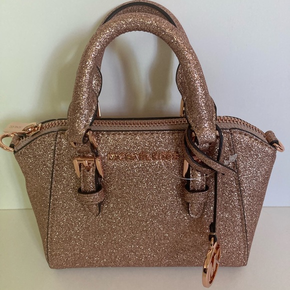 Michael Kors Handbags - NWT Authentic Michael Kors Rose Gold Glitter Mini Leather Bag